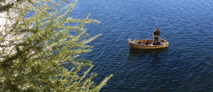 A fisherman on the San Valentino Lake