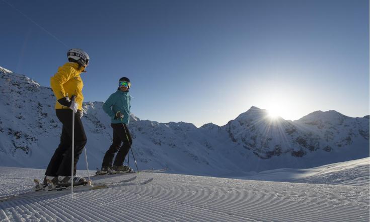 Two skiing people