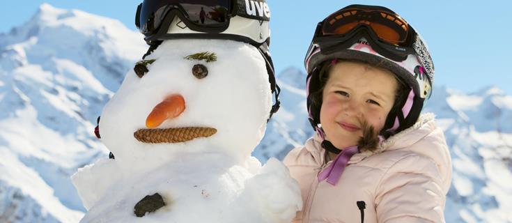 A child and a snowman