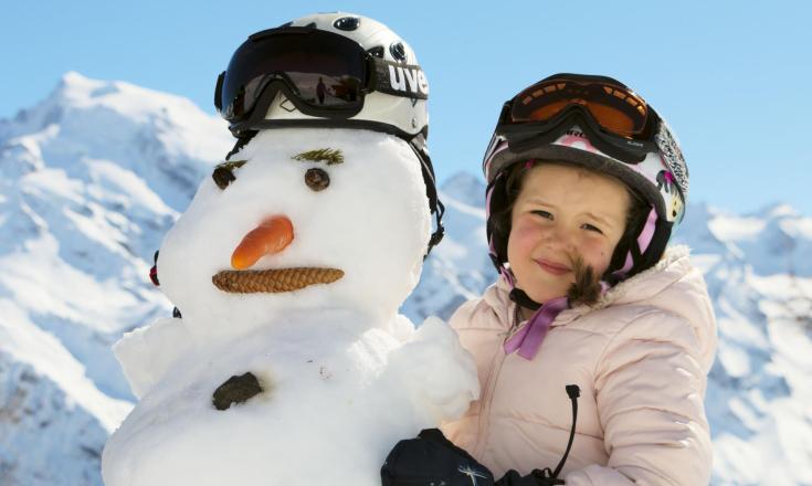 A child and a snowman