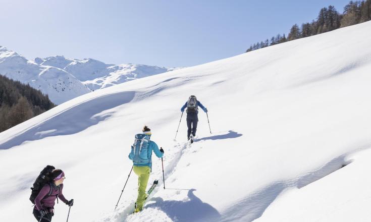 Three people on a ski tour